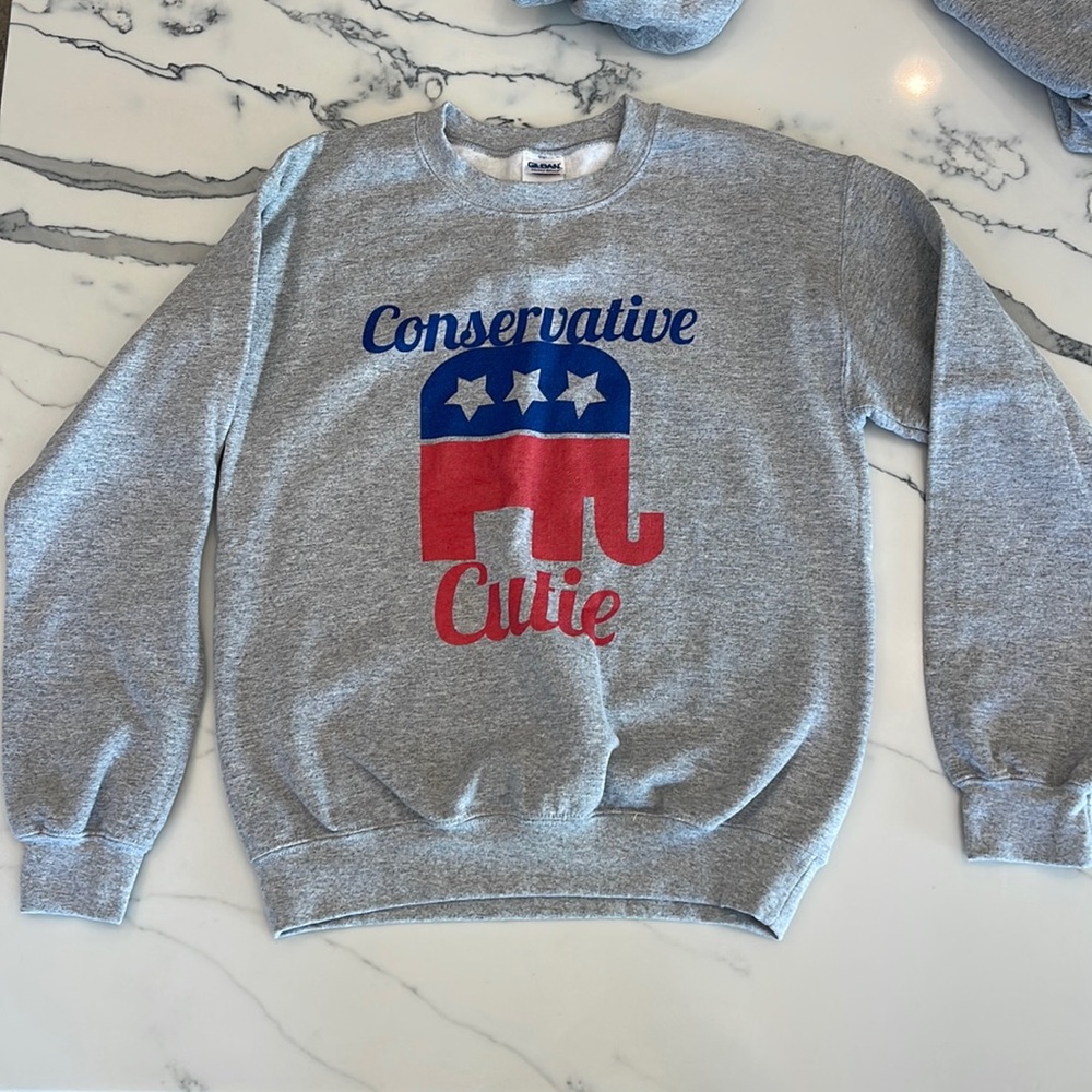 Grey pullover sweatshirt “Conservative Cutie” with an elephant on it.